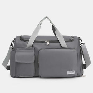 Oversized gray Oxford cloth travel bag with detachable strap and multiple pockets for convenient storage.