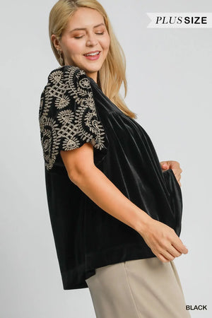 Umgee plus size black velvet blouse with intricately embroidered sleeves, perfect for stylish casual or dressy occasions.