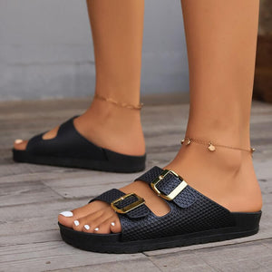 Double buckle open toe sandals in black, featuring a stylish design and comfortable flats for everyday wear.