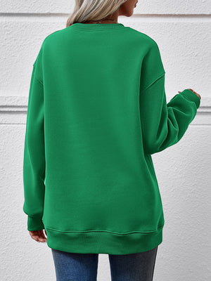 Back view of a green sweatshirt, showcasing its casual style and relaxed fit.