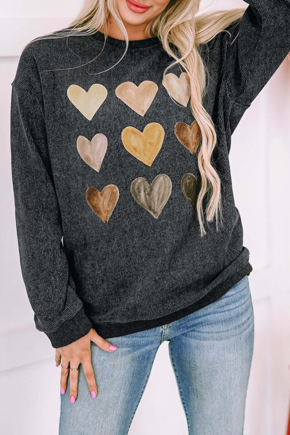 Heart round neck dropped shoulder sweatshirt in dark gray with colorful heart prints, ideal for casual wear.