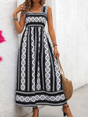 Elegant printed square neck wide strap cami dress in black and white with a flowy design, perfect for summer outings.