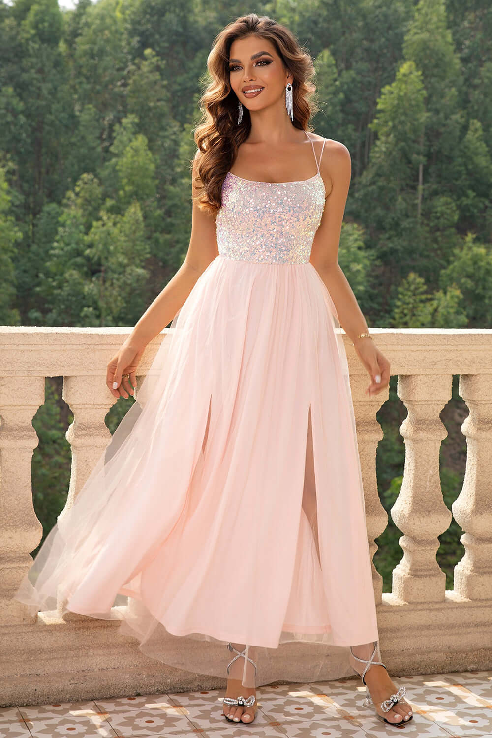 Elegant pink gown with sheer skirt and sequined bodice, perfect for special occasions and evening events.
