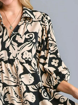 Close-up of Umgee Floral Print Tiered Midi Dress featuring elegant black and beige floral patterns, perfect for a chic look.