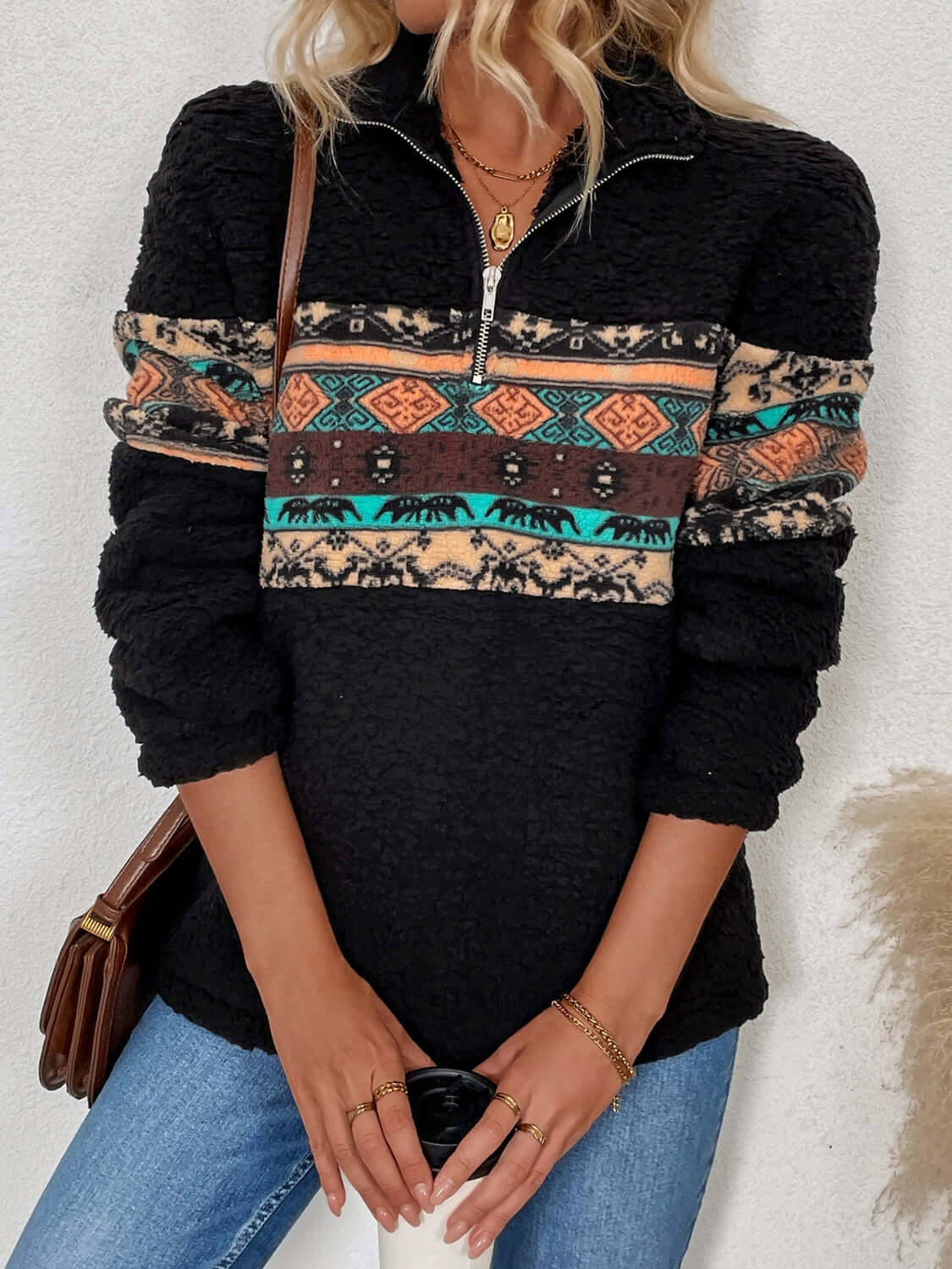 Stylish quarter zip geometric long sleeve sweatshirt with vibrant patterns and cozy fabric, perfect for casual wear.