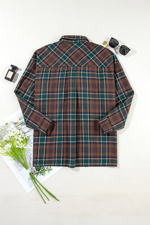Back view of a plaid button-up long sleeve jacket with brown, green, and blue patterns, styled with sunglasses and flowers.
