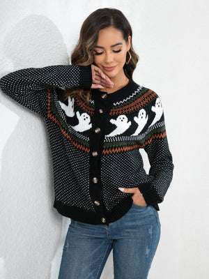 Woman wearing a ghost-printed black cardigan with buttons, styled with jeans against a white background.