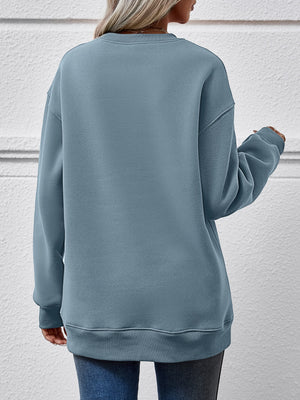 Back view of a cozy blue sweatshirt, featuring a relaxed fit and long sleeves, perfect for casual wear.