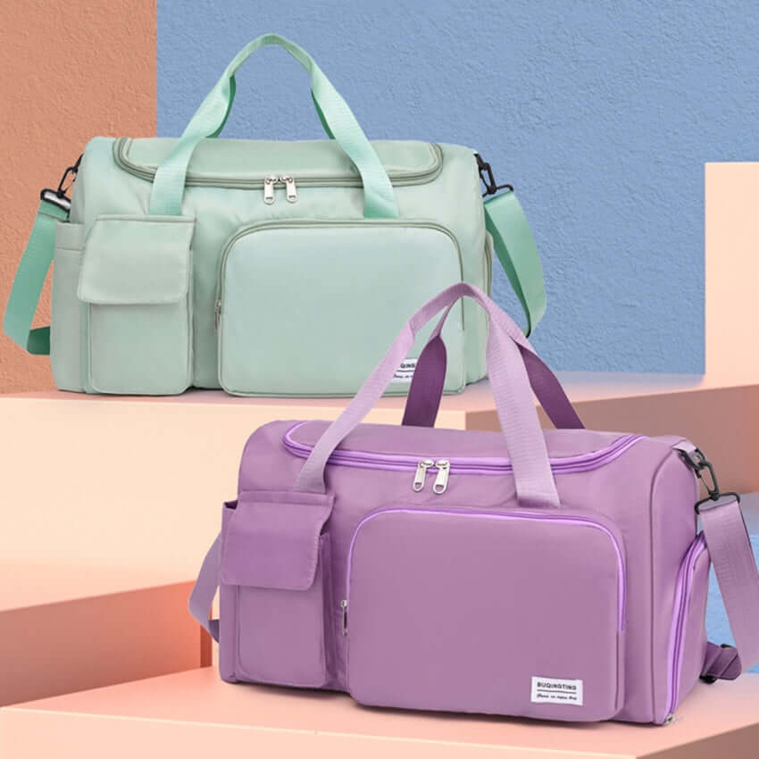 Oversize Oxford cloth travel bags in mint green and lavender with detachable straps, perfect for stylish travel and organization.