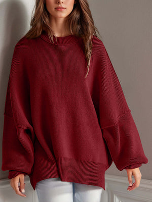 Chic side-slit sweater with cozy round neck, perfect for winter fashion and comfort.