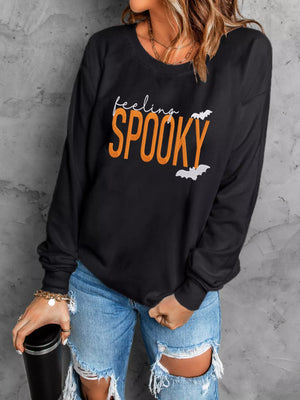 Black Halloween sweatshirt with 'Feeling Spooky' embroidery and bat design, perfect for October festivities.
