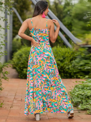 Back view of a Twisted Printed V-Neck Cami Dress in colorful leaf pattern, perfect for summer outings.