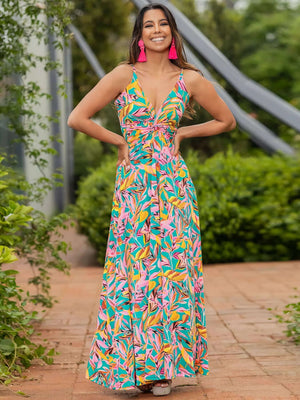 Twisted printed V-neck cami dress featuring a vibrant floral pattern, perfect for summer occasions and outdoor events.
