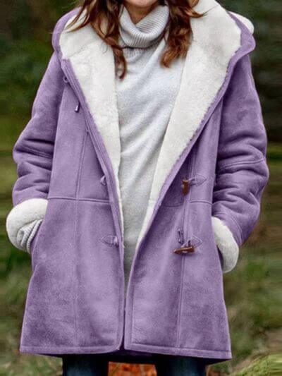 Full size pocketed long sleeve hooded toggle jacket in lavender with soft lining, perfect for cool weather.