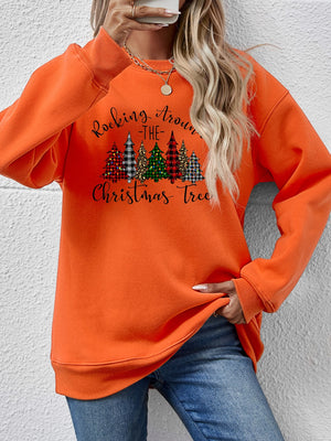 Orange Christmas tree graphic sweatshirt with text 'Rocking Around the Christmas Tree', cozy style for holiday wear.