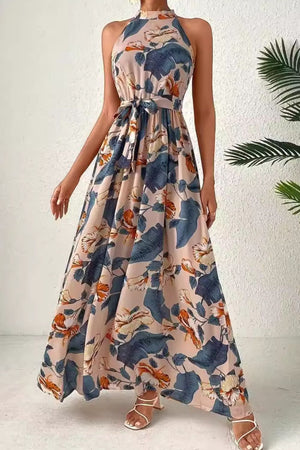 Elegant tied slit floral sleeveless dress with vibrant patterns, ideal for summer occasions and stylish events.