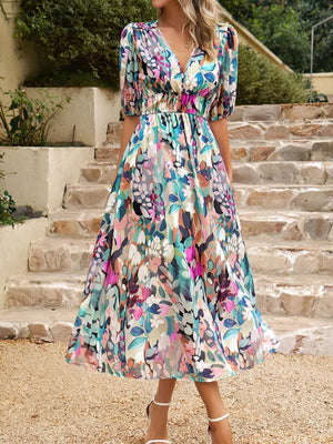 Colorful printed puff sleeve midi dress with floral design, perfect for summer outings.