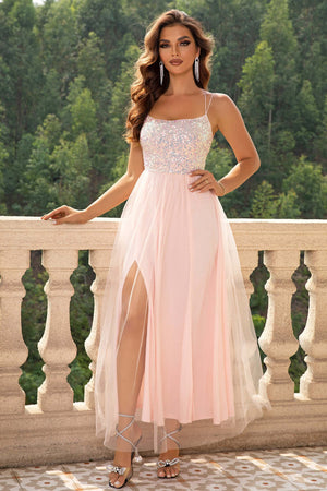 Elegant pink backless mesh dress with a high slit, perfect for formal occasions and special events.
