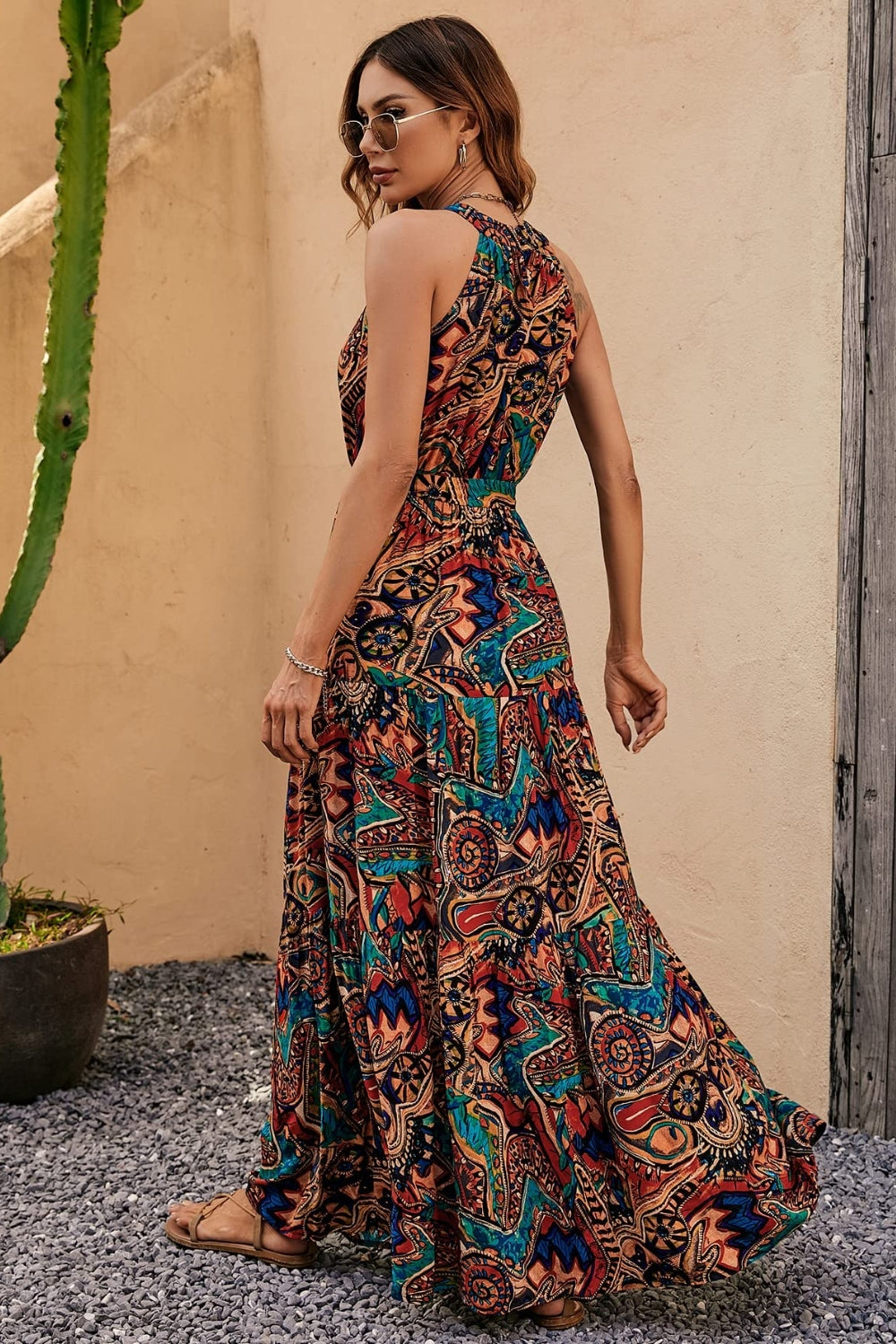 Bohemian styled floral sleeveless dress with vibrant patterns, perfect for summer outings.