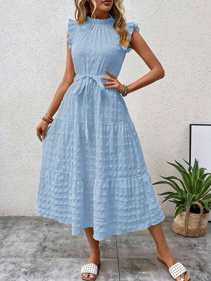 Light blue tied ruffled cap sleeve midi dress showcasing a tiered skirt, perfect for summer outings.