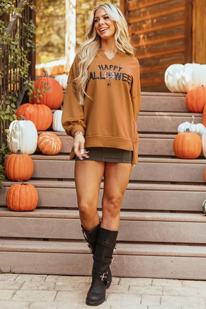 Happy Halloween long sleeve sweatshirt worn by a model, featuring sequin details and a high-low sheer design, amidst autumn pumpkins.