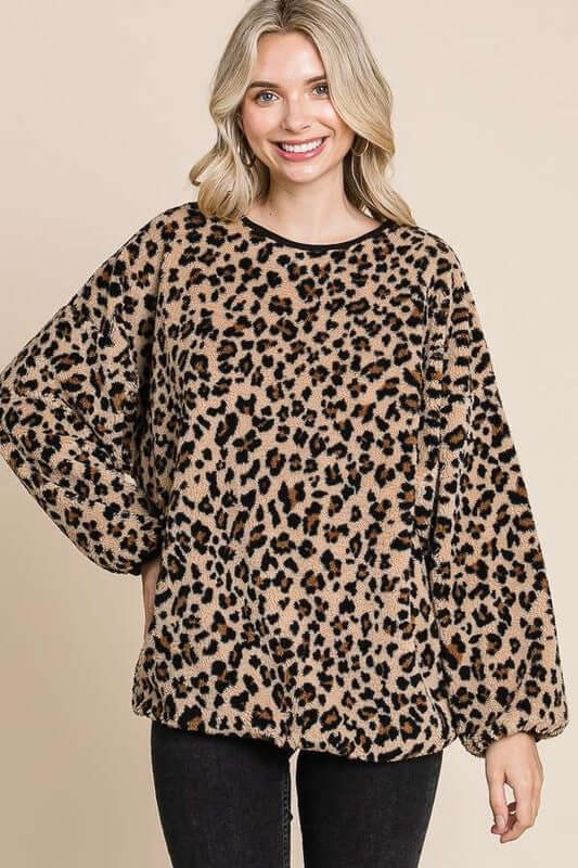 Leopard faux fur round neck top with stylish print, perfect for adding chic edge to any outfit.