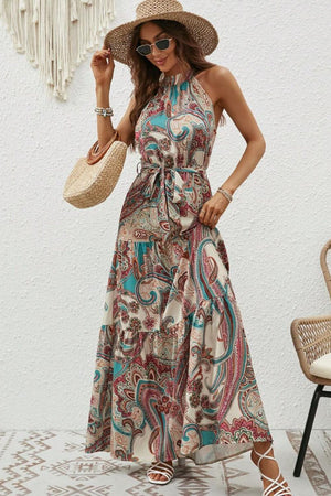 Tied slit floral sleeveless dress with paisley print, perfect for summer outings and beach days.