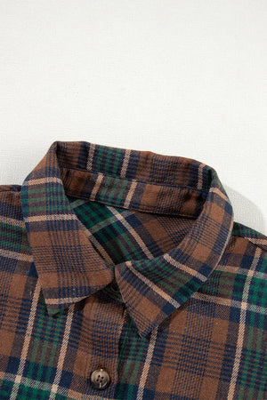 Close-up of a plaid button-up long sleeve jacket in earthy tones, showcasing its collar and button details.