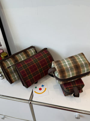 Contrast plaid clutch bags with zippers in various sizes, featuring stylish and vibrant patterns, perfect for any occasion.