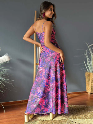 Model wearing a purple and pink twisted printed V-neck cami dress, showcasing its flowy design and back view.