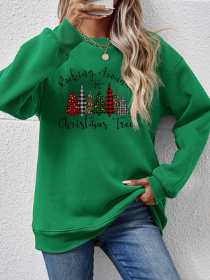 Green sweatshirt with Christmas tree graphic, perfect for festive occasions and cozy winter wear.