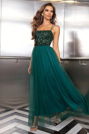 Elegant green sequin dress with a flowing tulle skirt, perfect for formal occasions and special events.