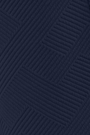 Close-up of textured navy fabric featuring a modern geometric pattern for stylish outfits.