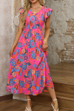 Boho floral V-neck ruffle tiered dress in vibrant pink with colorful flowers, perfect for casual summer outings.