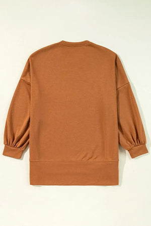 Back view of a cozy brown long sleeve sweatshirt with balloon sleeves and a relaxed fit.