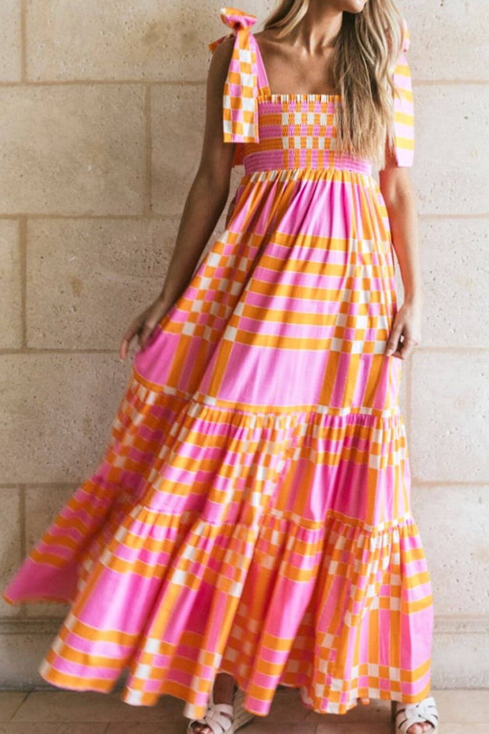Color block tie shoulder dress with pink and orange stripes, perfect for summer events. Made of 100% polyester, machine washable.