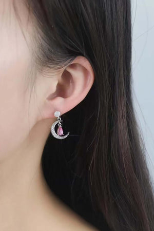 Stylish 2 Carat Moissanite 925 Sterling Silver Moon & Star Earrings showcased on a model.