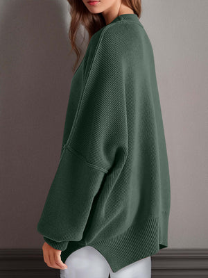 Chic side-slit sweater in green with cozy round neck, perfect for winter styling and comfort.