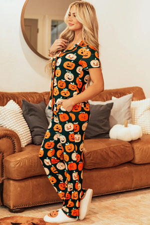 Woman wearing a pumpkin printed short sleeve top and pants lounge set, ideal for cozy fall days.