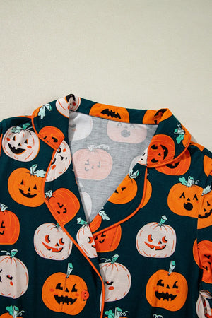 Close-up of a pumpkin printed short sleeve top featuring vibrant Halloween-themed designs and a classic collar.