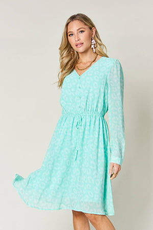 Double Take V-Neck Long Sleeve Dress in mint green with a ruched design and button details.