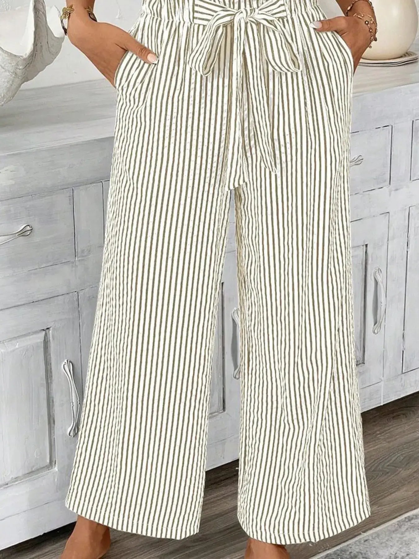 Full size striped wide leg paper bag pants feature pockets and tie waist, ideal for plus size fashion.