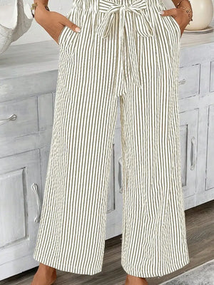 Full size striped wide leg paper bag pants feature pockets and tie waist, ideal for plus size fashion.