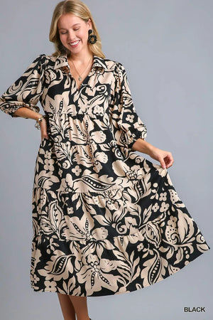Umgee black floral print tiered midi dress, perfect for spring and summer events, offering a chic and elegant silhouette.