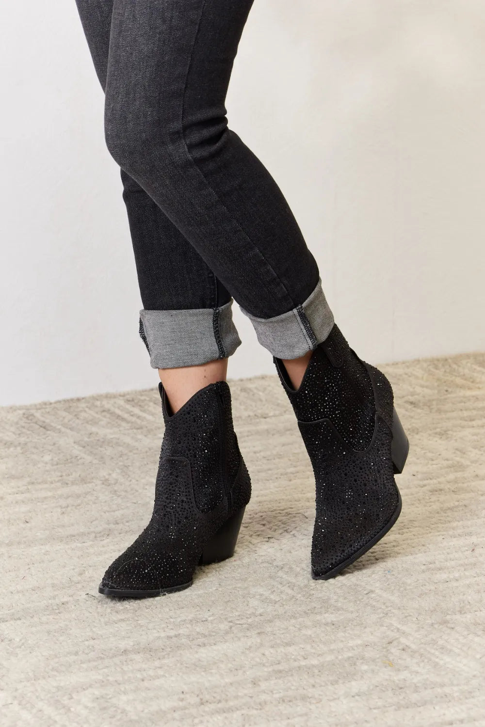 East Lion Corp Rhinestone Ankle Cowboy Boots featuring a stylish black design with rhinestones.