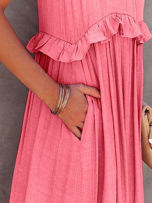 Close-up of a ruffled sleeveless tiered maxi dress in pink with pockets, showcasing the soft fabric and detailed ruffles.