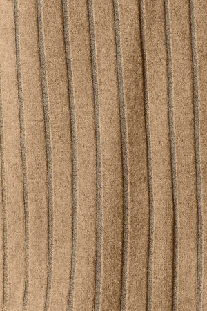 Close-up of textured fabric featuring vertical ribbed lines in a warm tan color.