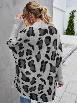 Back view of a woman wearing an Angel Wings leopard pattern fuzzy cardigan with long sleeves.