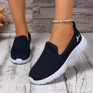 Lightweight breathable mesh slip-on shoes in navy with low heels, perfect for casual wear.