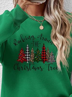 Holiday-themed Christmas tree graphic sweatshirt in vibrant green with stylish plaid designs and festive lettering.